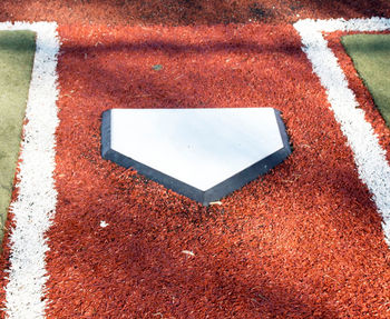 High angle view of arrow sign on the ground