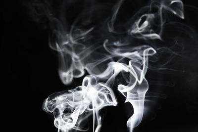 Close-up of smoke against black background