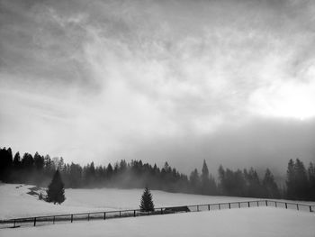 Scenic view of landscape against sky during winter