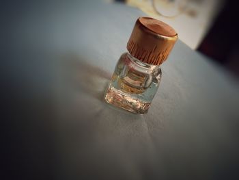High angle view of glass bottles on table in restaurant