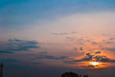 Low angle view of dramatic sky during sunset