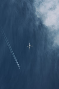 Low angle view of airplane flying in sky