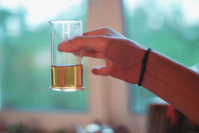 Close-up of hand holding drink