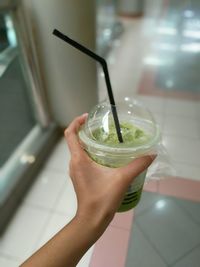 Close-up of hand holding drink