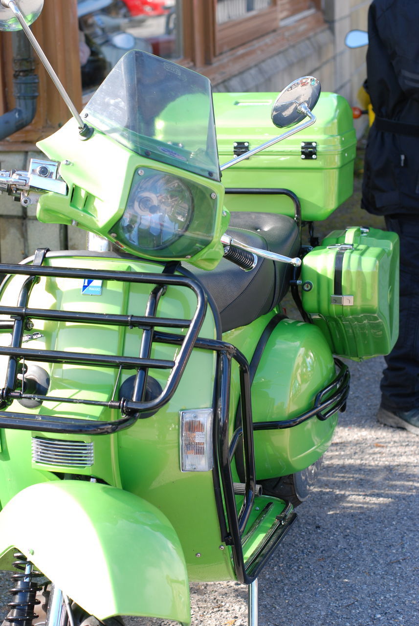 CLOSE-UP OF GREEN TRUCK IN ROW