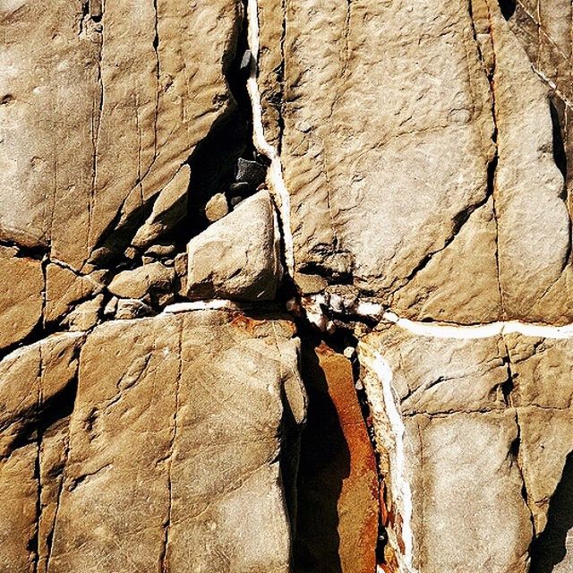 textured, rough, wall - building feature, weathered, wall, close-up, backgrounds, full frame, built structure, old, architecture, day, stone wall, damaged, outdoors, no people, rock - object, cracked, low angle view, rock formation