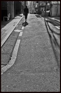 Man walking on road