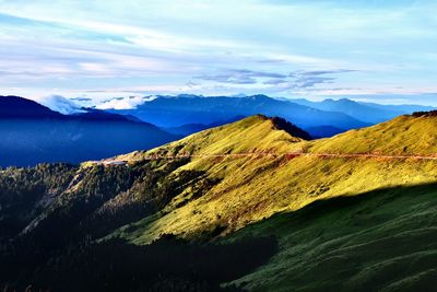 Scenic view of mountain range against sky