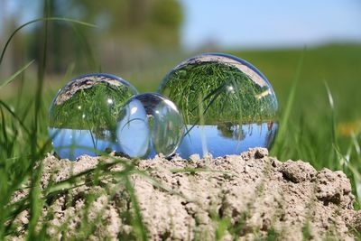 Close-up of crystal ball on rock