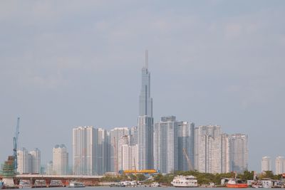 Modern buildings in city against sky