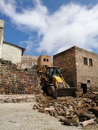 Panoramic view of construction site against sky in city