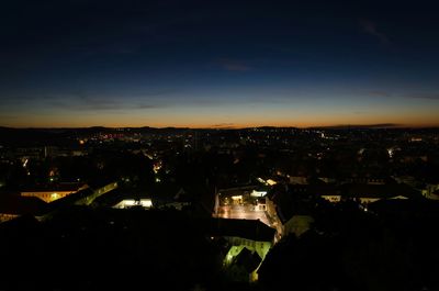 Buildings in city at sunset