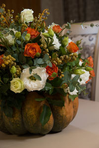 Close-up of roses in vase on table