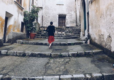 Full length of woman standing in old building