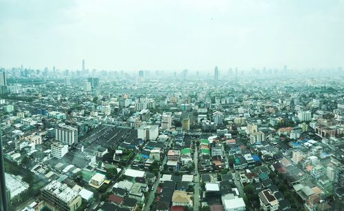 Aerial view of cityscape against sky