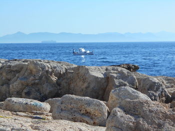 Scenic view of sea against blue sky