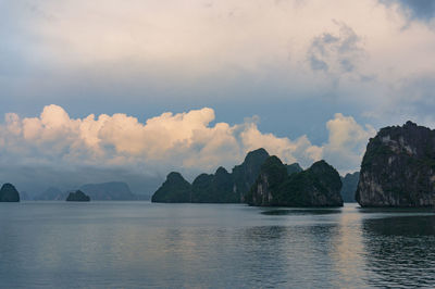 Panoramic view of sea and mountains against sky