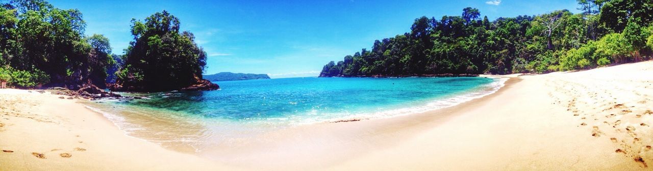 water, land, tree, sea, beach, scenics - nature, sky, nature, beauty in nature, plant, sand, panoramic, tranquility, travel destinations, tranquil scene, blue, body of water, travel, vacation, trip, holiday, tropical climate, idyllic, landscape, environment, coastline, island, tourism, day, outdoors, no people, sunlight, summer, coast, cloud, turquoise colored, bay, shore, lagoon, non-urban scene, tropics, sunny, forest