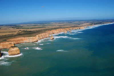 Scenic view of sea against blue sky