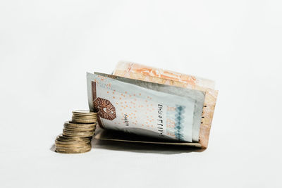 Close-up of coin against white background