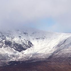 Scenic view of snowcapped mountain against sky