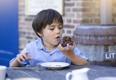 Portrait of boy eating food