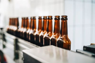 Close-up of wine bottles on table