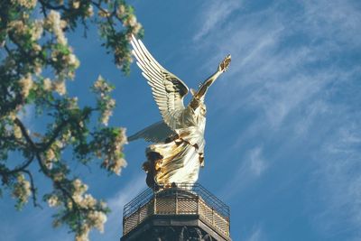 Low angle view of statue against sky