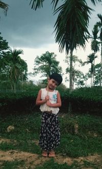 Portrait of girl standing on land