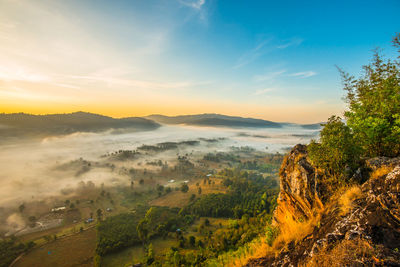 Scenic view of landscape against sky during sunset