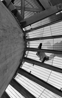 Low angle view of woman walking on staircase