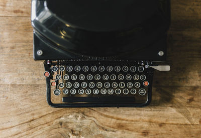 Directly above shot of typewriter on wooden table