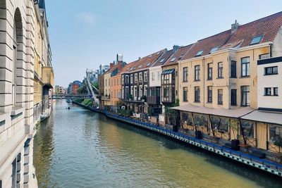 Canal amidst buildings in city