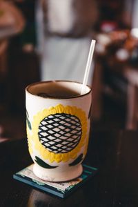 Close-up of coffee cup on table