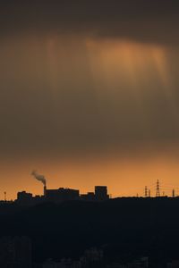 Silhouette of city at sunset