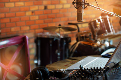 Close-up of headphones on sound mixer