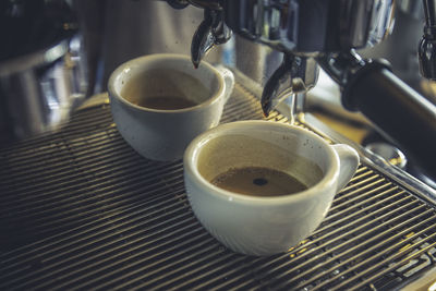 Close-up of coffee cup on table