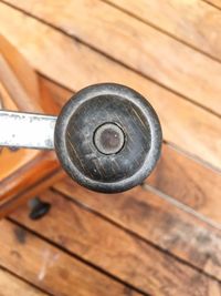 High angle view of metallic object on wooden table