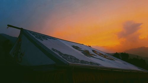 Snow covered landscape at sunset