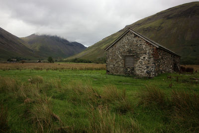 House on field against sky