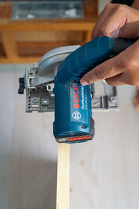 Close-up of man working on metal