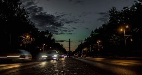 Cars on street at night