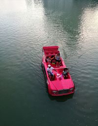 High angle view of red boat floating in lake