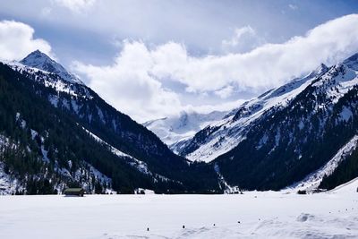 Scenic view of snowcapped mountains against sky