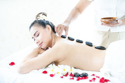 Midsection of woman lying on table