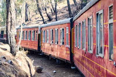 Kalka shimla toy train moving on mountain slopes, beautiful view, one side mountain, one side valley