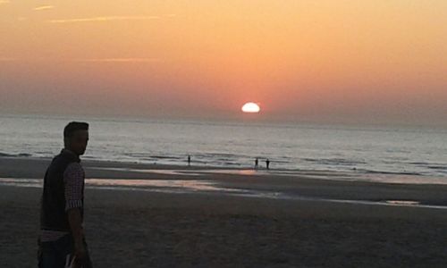 Scenic view of sea at sunset