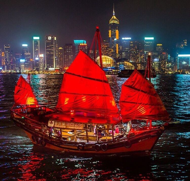 BOATS SAILING ON RIVER