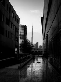 Modern buildings in city against sky