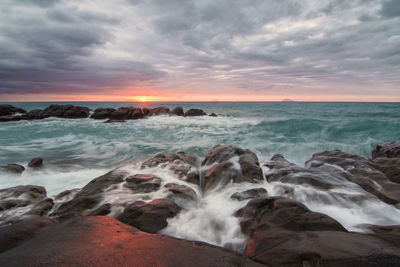 Scenic view of sea against sky during sunset